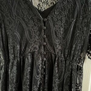 Black Lace dress with attached under slip. Shorter in front than back. Like new.